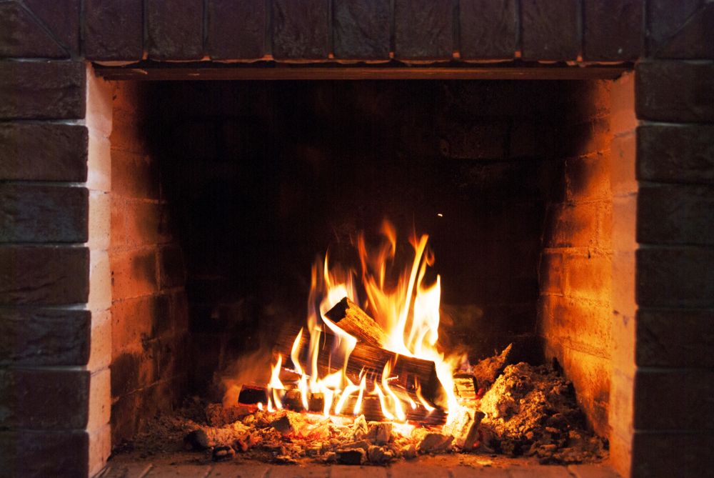 A closeup image of a wood burning fireplace